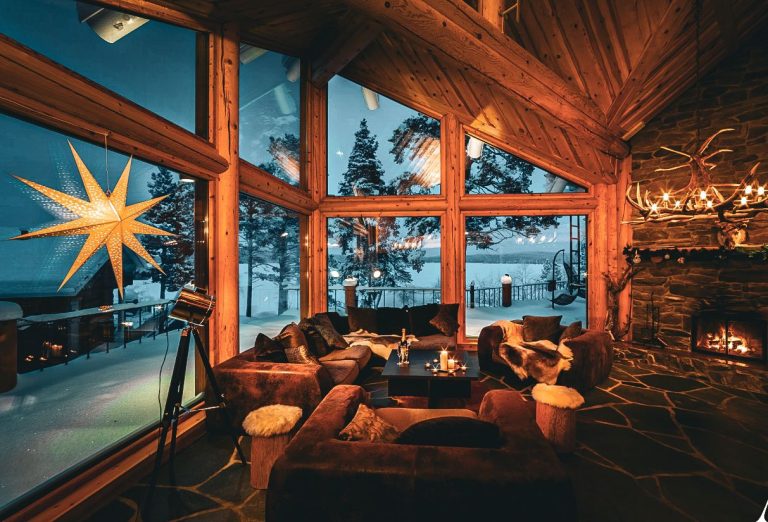 Home A luxurious lounge with a stone fireplace, soft lighting, and elegant Scandinavian design